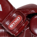 BYKO boxing glove wrist strap – maroon leather branding close-up
