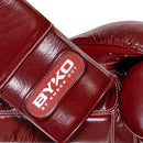 BYKO Superlace XPro boxing glove maroon – wrist cuff branding and leather texture close-up